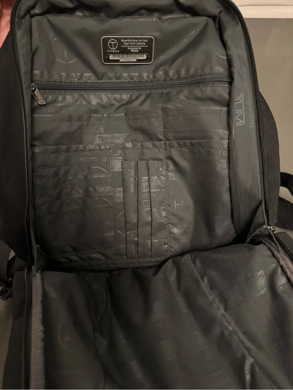 Tumi Black Tech Backpack with Subtle Red Accent
